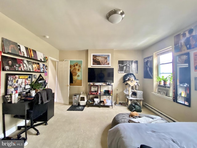 bedroom with baseboards, baseboard heating, and carpet