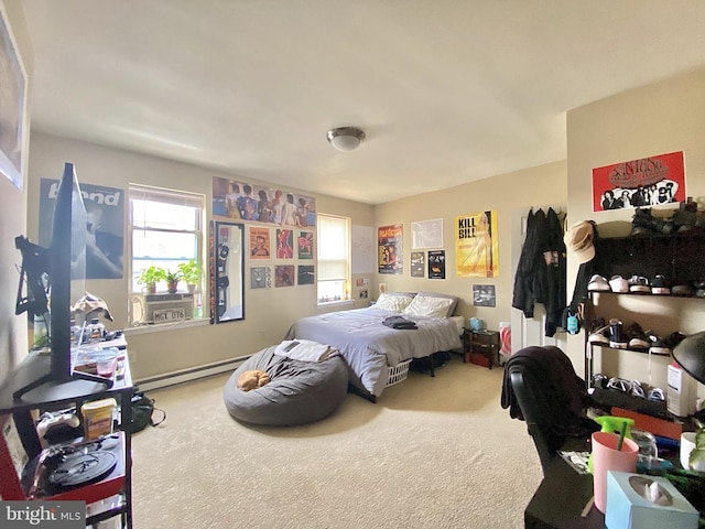 carpeted bedroom with a baseboard heating unit