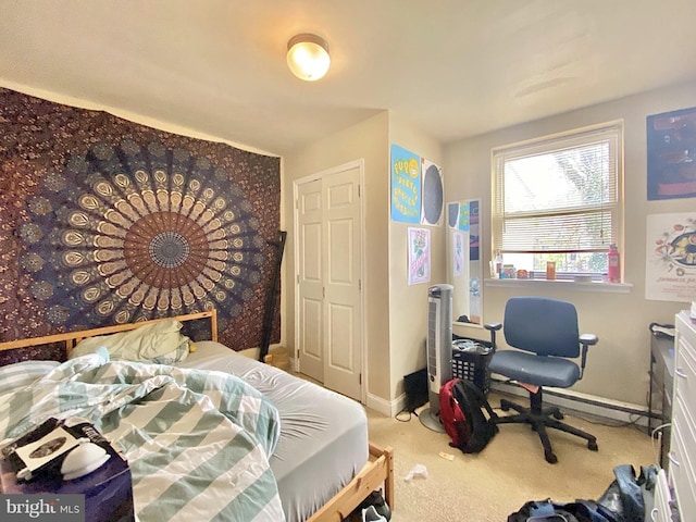 carpeted bedroom with baseboards