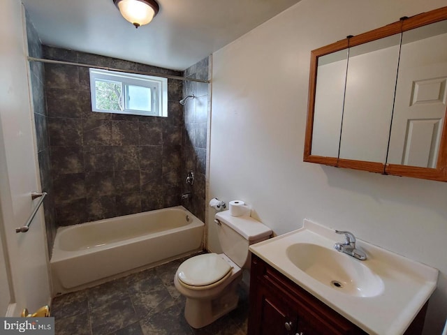 bathroom with vanity, toilet, and shower / bathtub combination