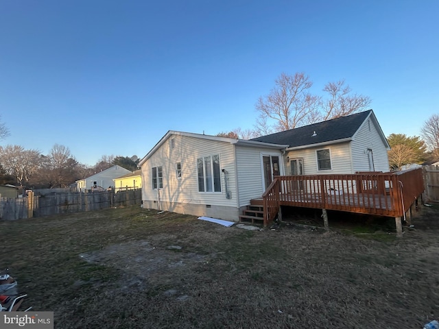 rear view of property featuring crawl space, a lawn, and fence private yard