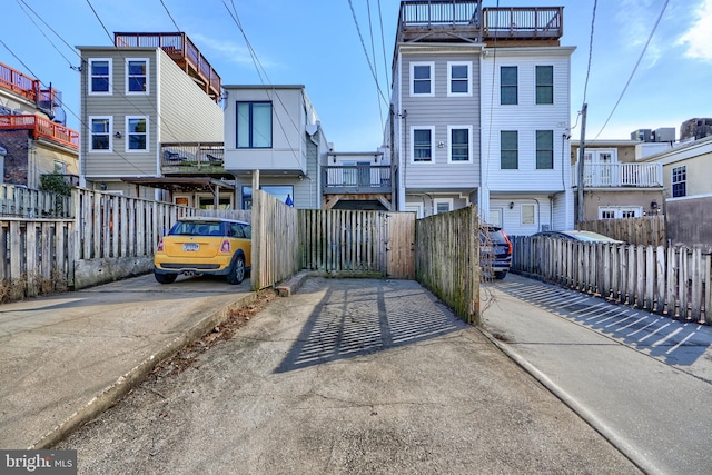 view of front of home featuring fence