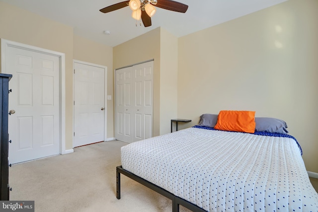 bedroom featuring a closet, a ceiling fan, baseboards, and carpet floors