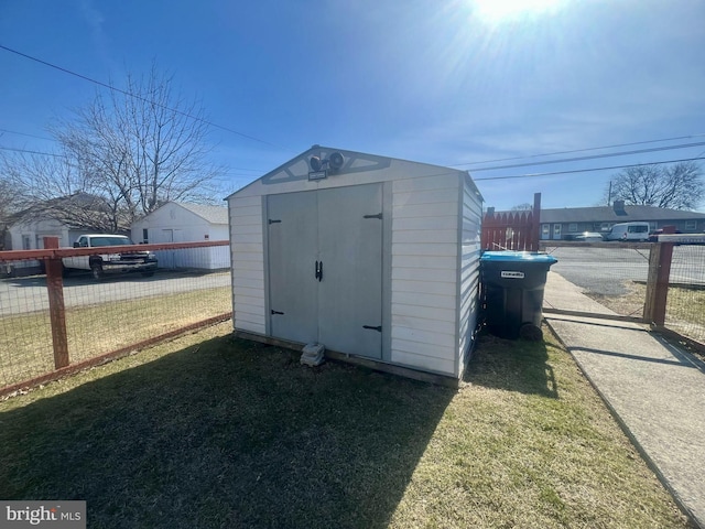 view of shed with fence