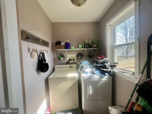 washroom with laundry area and independent washer and dryer