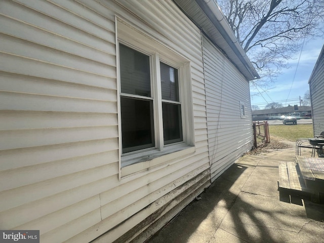 view of side of home with a patio area