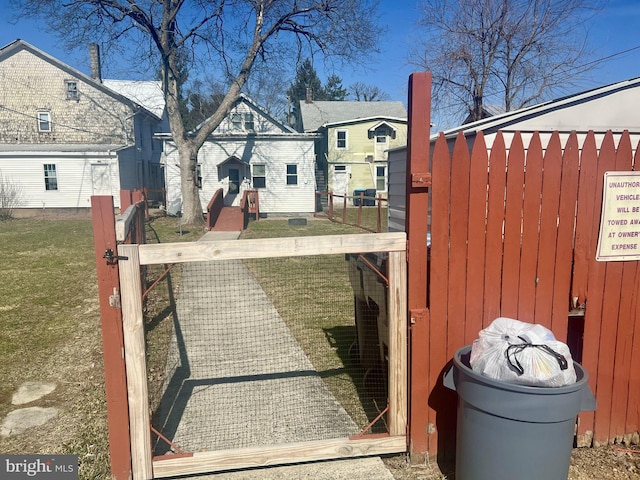 view of gate with fence