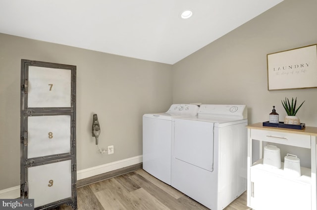 laundry room with independent washer and dryer, light wood-style flooring, recessed lighting, baseboards, and laundry area