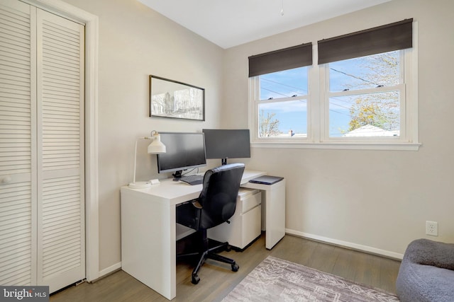 office area featuring baseboards and wood finished floors