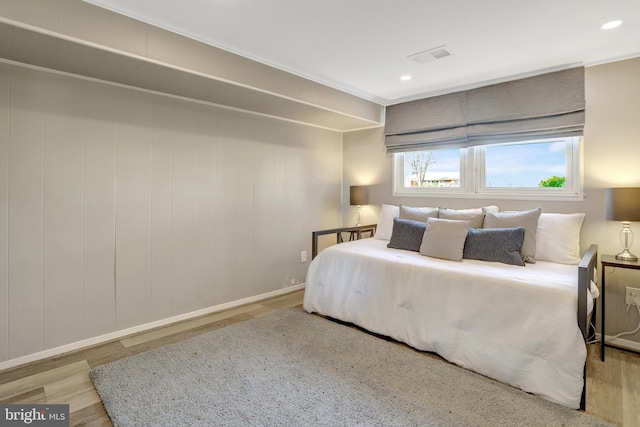 bedroom featuring visible vents, recessed lighting, and wood finished floors