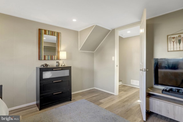 interior space featuring recessed lighting, visible vents, baseboards, and wood finished floors