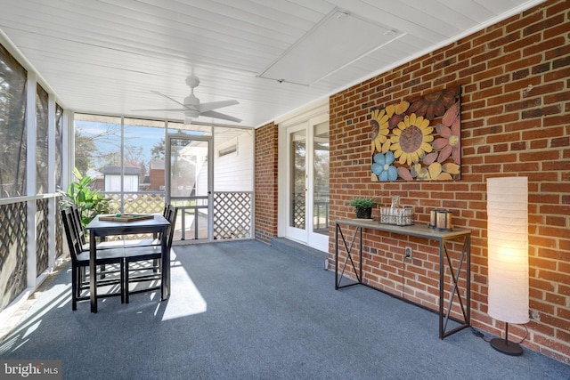 sunroom with a ceiling fan