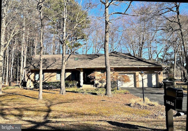 exterior space featuring an attached garage and driveway