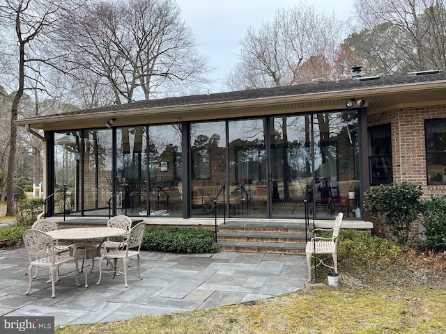 view of patio / terrace with a sunroom