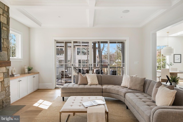 living area with light wood-type flooring, plenty of natural light, coffered ceiling, and beamed ceiling