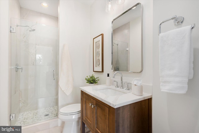 full bath featuring vanity, toilet, and a stall shower