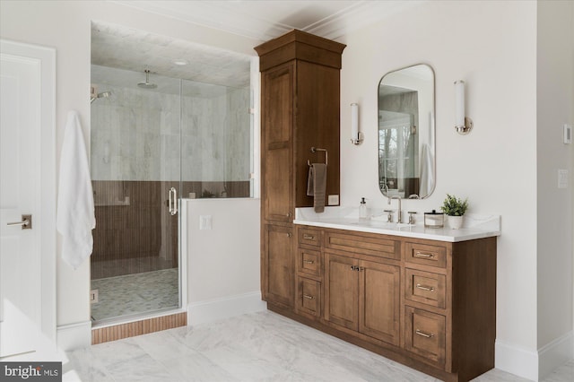 full bathroom with vanity, a shower stall, and baseboards