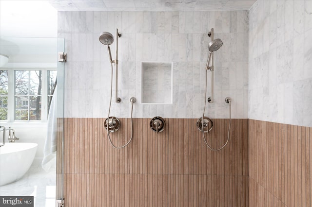 full bathroom featuring tiled shower