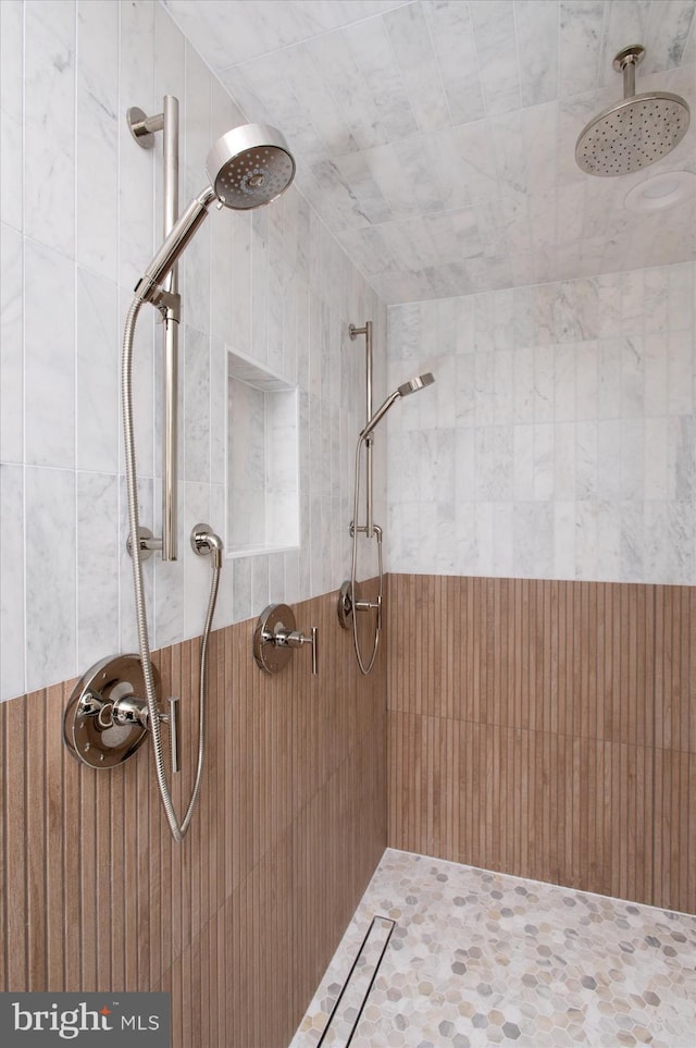 full bath with a tile shower