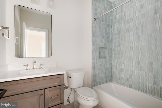 bathroom featuring toilet, vanity, and shower / bathing tub combination