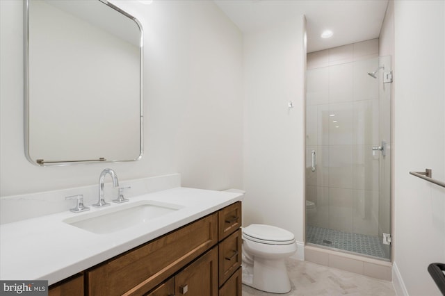 bathroom with a stall shower, toilet, and vanity