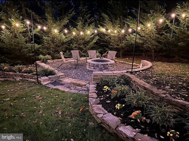 patio at twilight with a fire pit