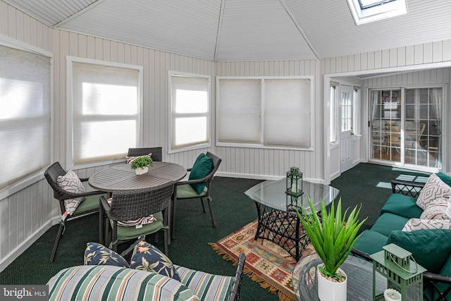 sunroom / solarium with lofted ceiling with skylight