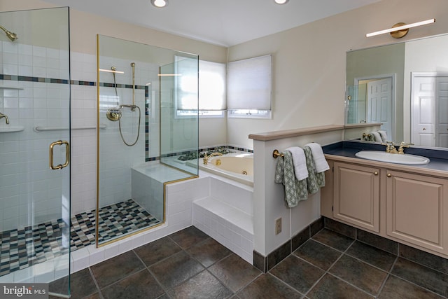 bathroom featuring recessed lighting, a tub with jets, a stall shower, and vanity