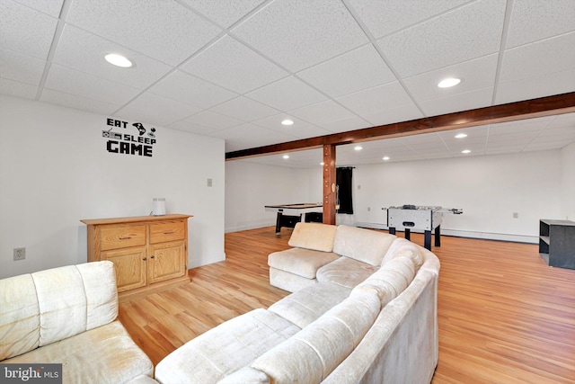 living room with recessed lighting, light wood-type flooring, and a baseboard radiator