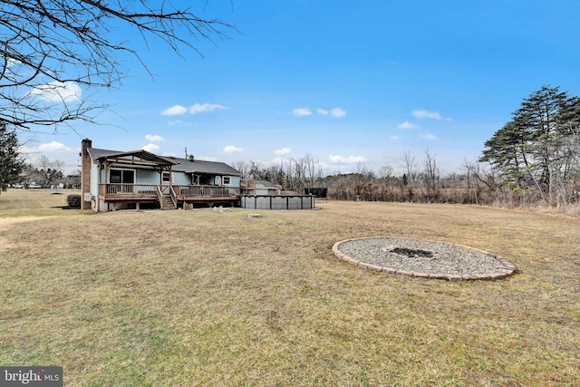 view of yard with a wooden deck