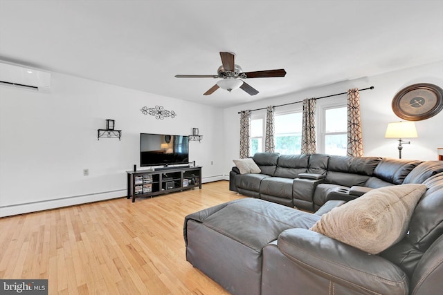 living area with light wood-type flooring, a baseboard radiator, a ceiling fan, and a wall mounted AC