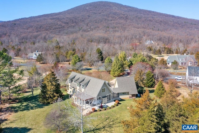 aerial view featuring a mountain view and a wooded view