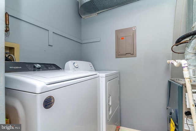 laundry area featuring electric panel, laundry area, and independent washer and dryer