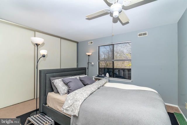 bedroom featuring carpet flooring, a ceiling fan, visible vents, and baseboards