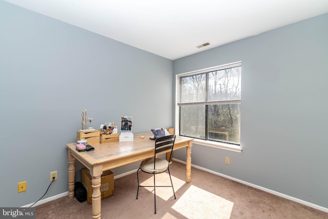 home office featuring visible vents, carpet floors, and baseboards