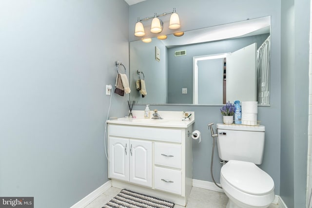 bathroom with visible vents, baseboards, toilet, and vanity