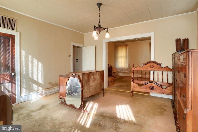 interior space with a chandelier, carpet floors, a healthy amount of sunlight, and ornamental molding