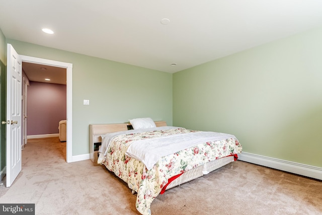 bedroom featuring recessed lighting, baseboards, carpet floors, and a baseboard radiator