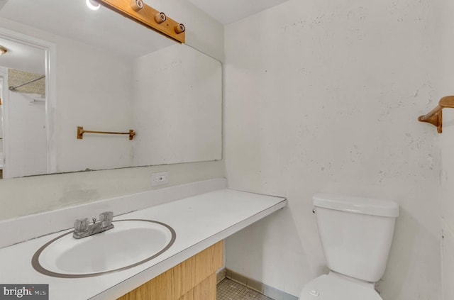 bathroom with toilet and vanity