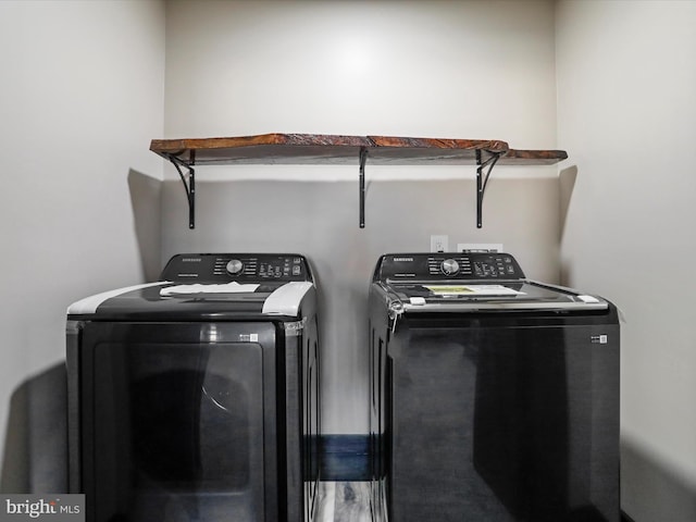 laundry area featuring independent washer and dryer and laundry area