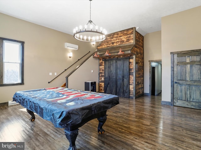 playroom featuring billiards, wood finished floors, a chandelier, and a wall mounted AC