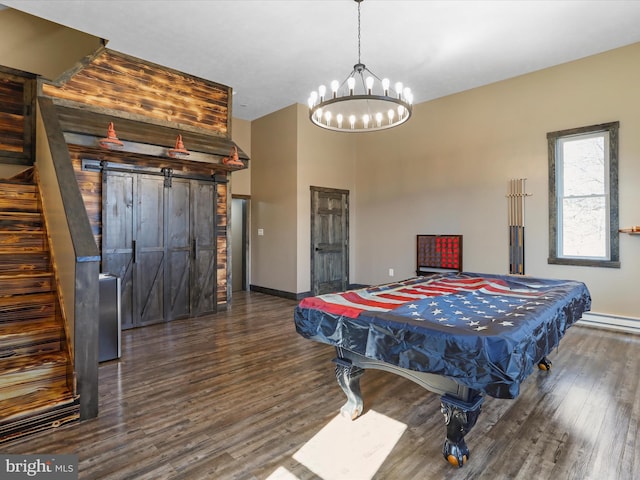 playroom with baseboards, an inviting chandelier, wood finished floors, and pool table