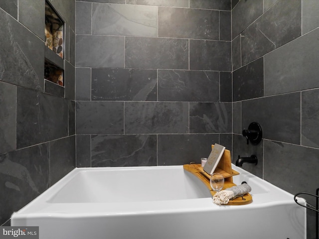 bathroom featuring a tub to relax in