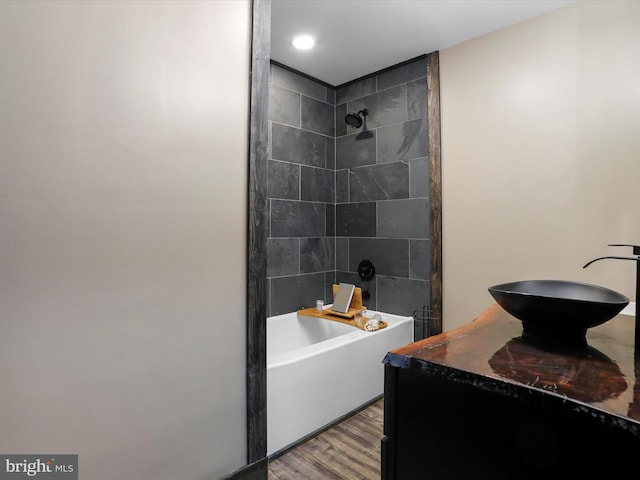 bathroom with vanity, shower / bathing tub combination, and wood finished floors