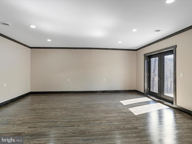 unfurnished room with crown molding, french doors, visible vents, and baseboards