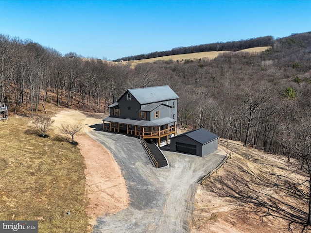 bird's eye view with a rural view and a forest view