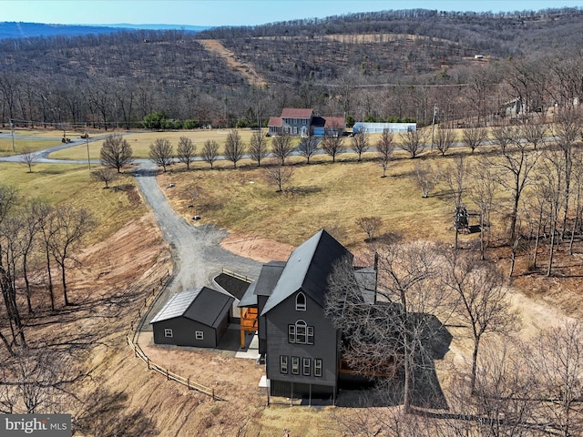 drone / aerial view with a rural view and a view of trees