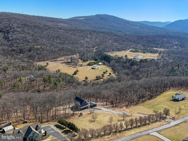 bird's eye view with a mountain view, a rural view, and a wooded view