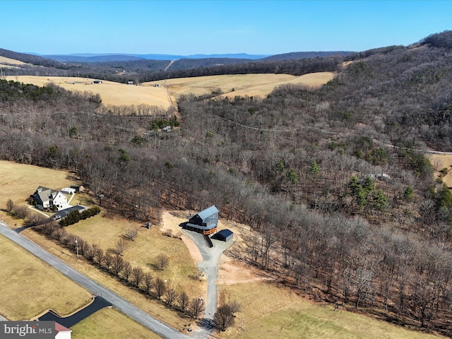 drone / aerial view featuring a mountain view and a rural view