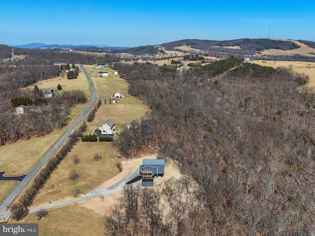 drone / aerial view featuring a rural view and a mountain view